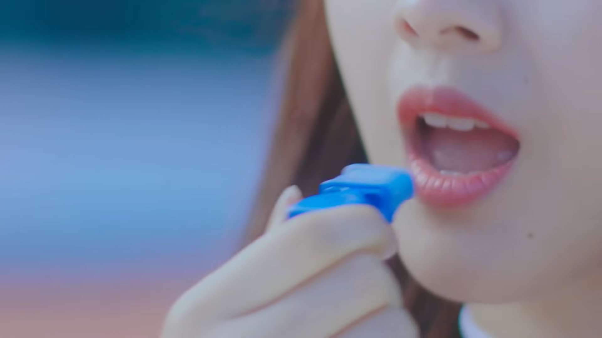Haseul holding a whistle.